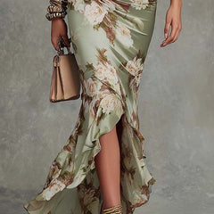 Anna - Asymmetrical long dress in green satin with V-neck, flared puff sleeves, and floral pattern