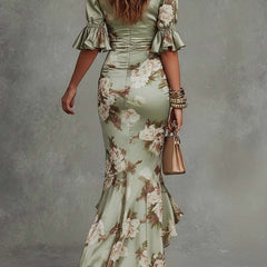 Anna - Asymmetrical long dress in green satin with V-neck, flared puff sleeves, and floral pattern
